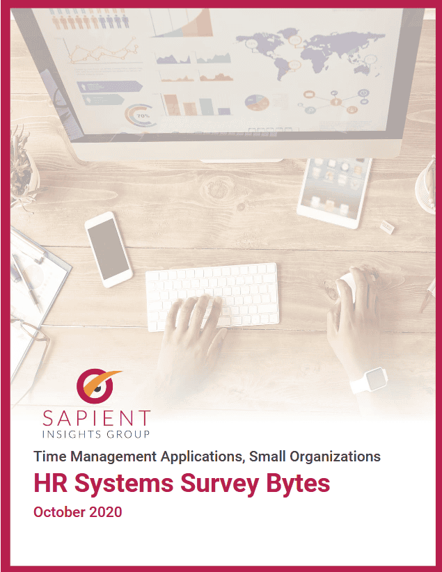 Business analyst working on HR systems survey data with computer, tablet, and smartphone for HR analytics insights.